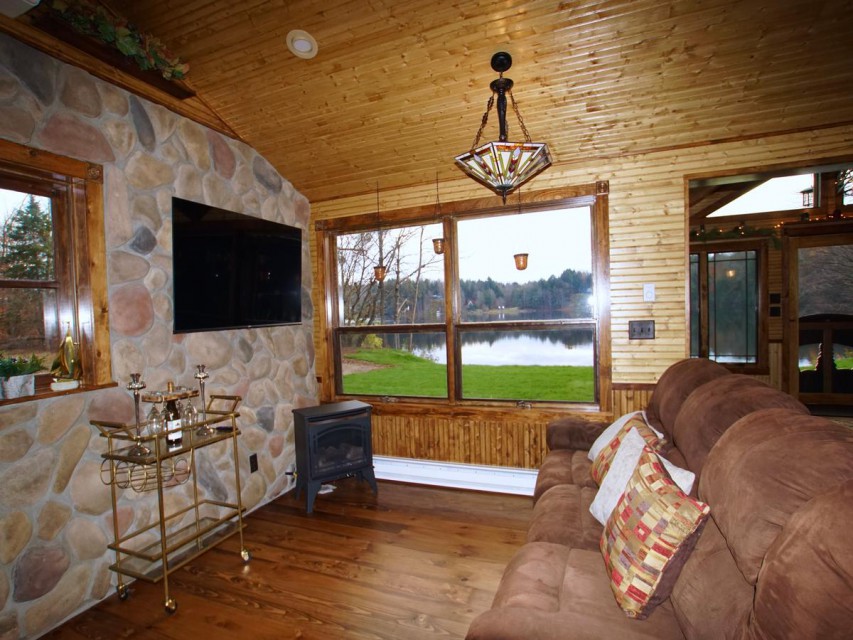 Sitting area withers fireplace and TV