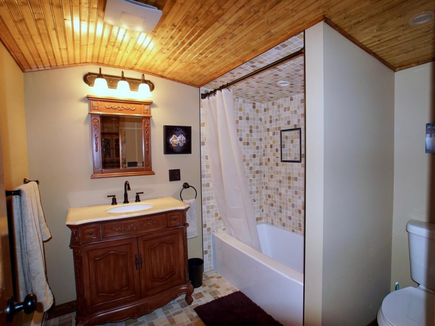 Bathroom with tub and shower