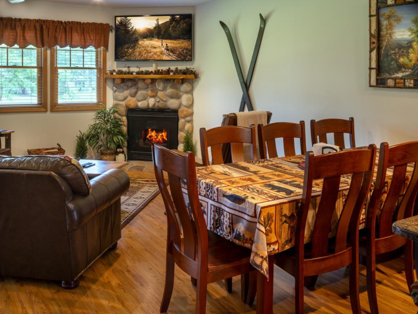 The dining room area has a big table and seating for 8!