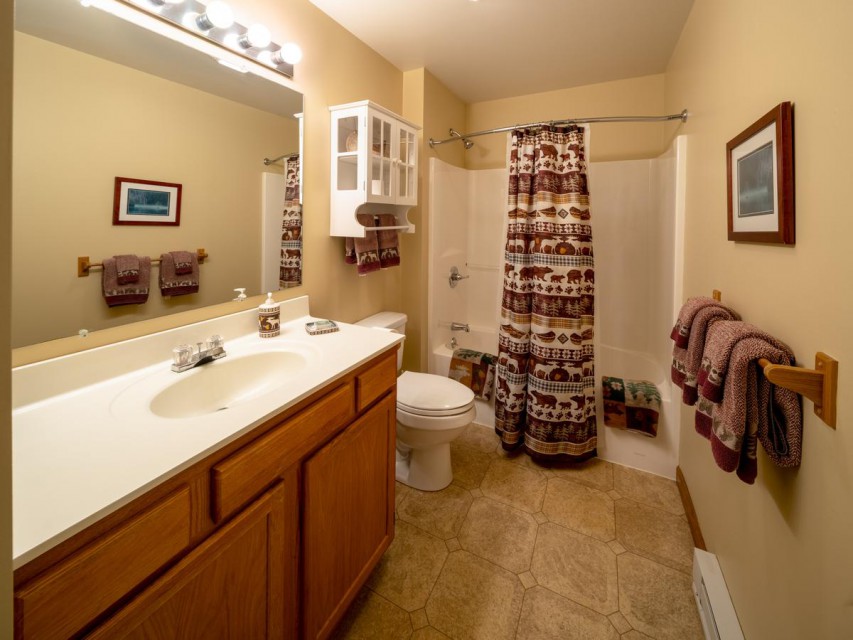 The upper level full bathroom, with a shower tub... 