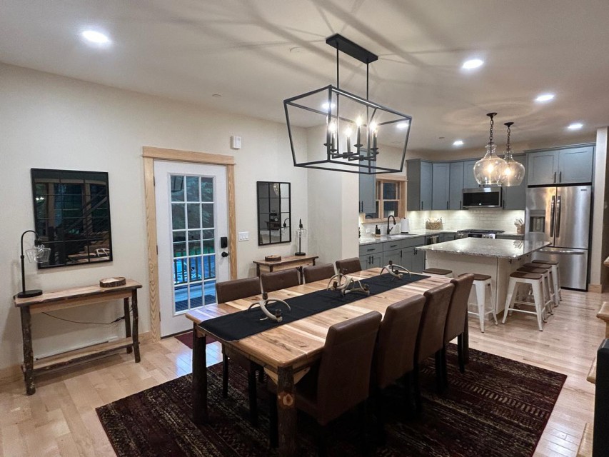 Modern kitchen fully stocked and open to dining table