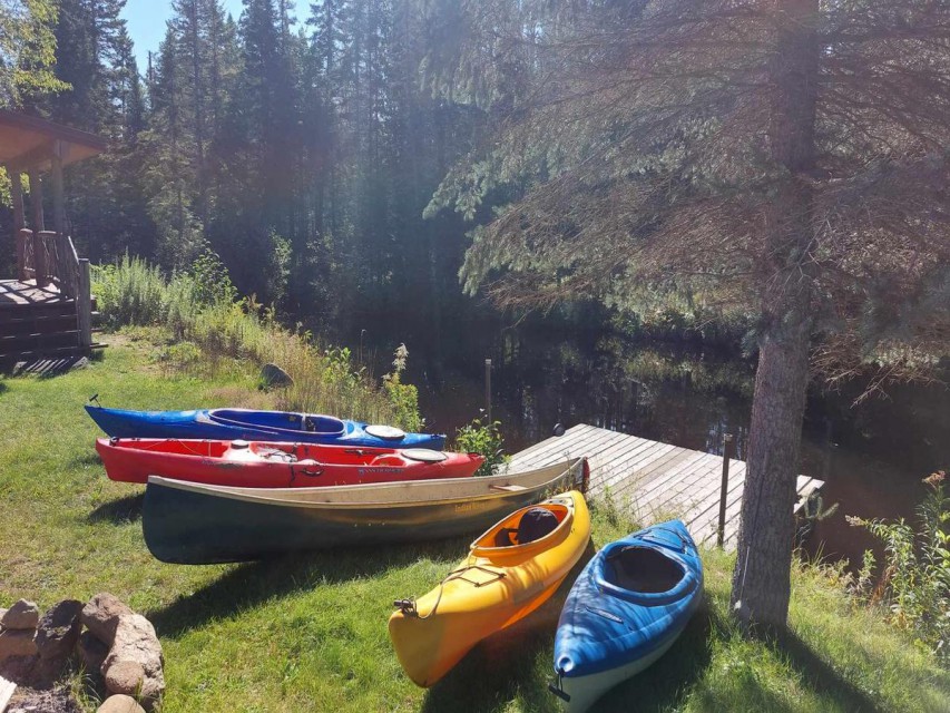 4 Kayaks, Canoe, and Fishing boat included