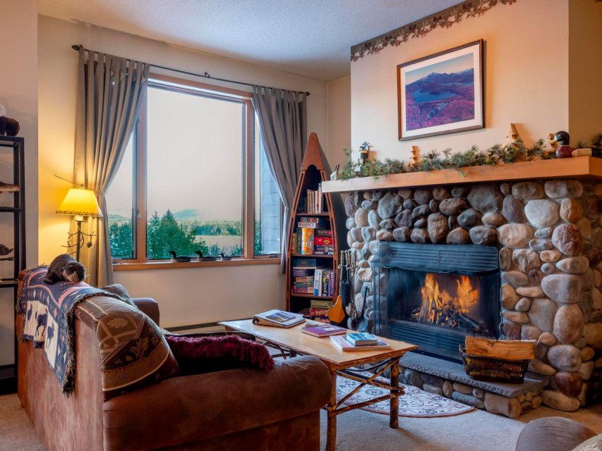 The living room area, with a wood burning fireplace!