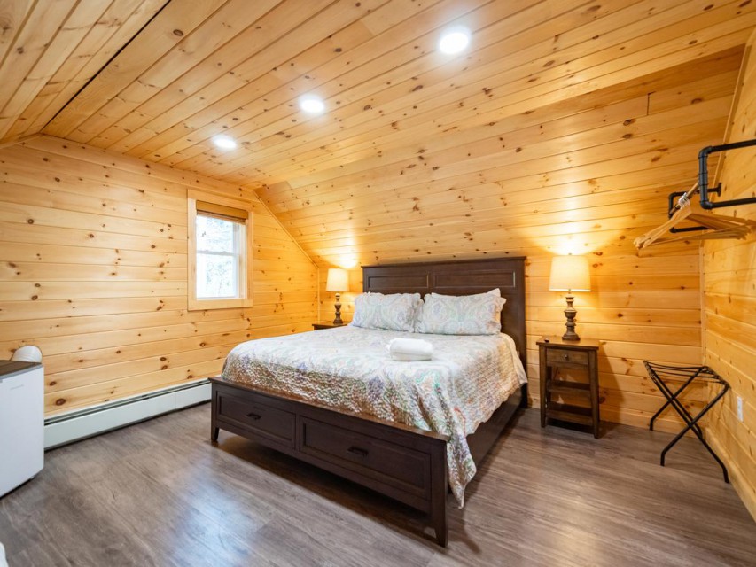 Second upstairs bedroom with king sized bed and TV