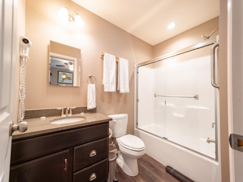 Primary bathroom with tub shower combo.