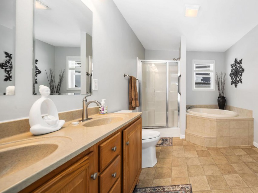 Ensuite bathroom is spacious with dual vanity. 