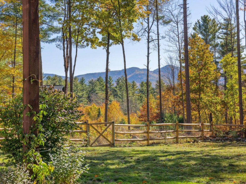 Fenced-in yard and views of the Jay Mountain Range.