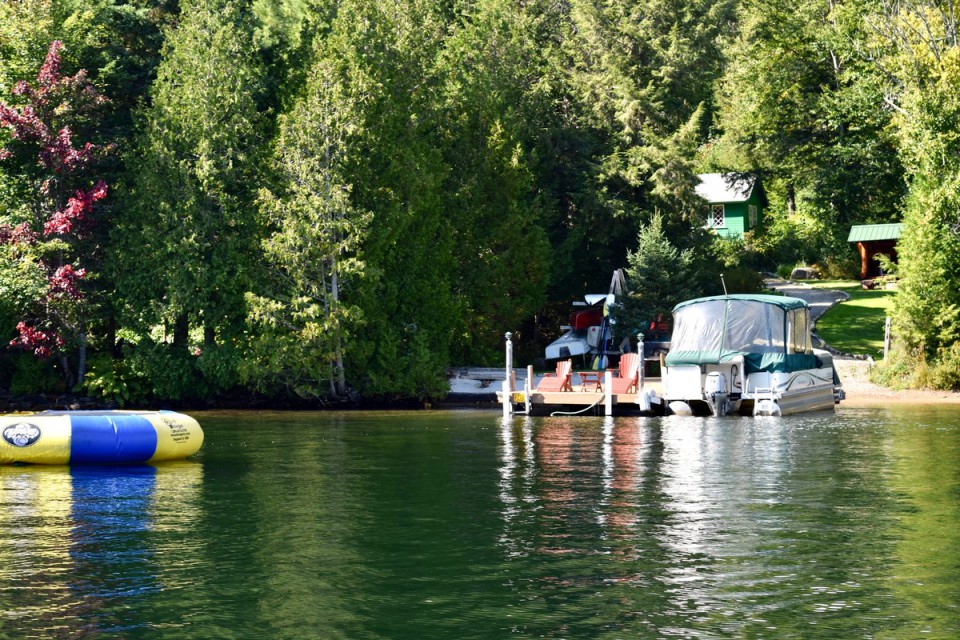 From the water looking at our dock, lean-to, and house