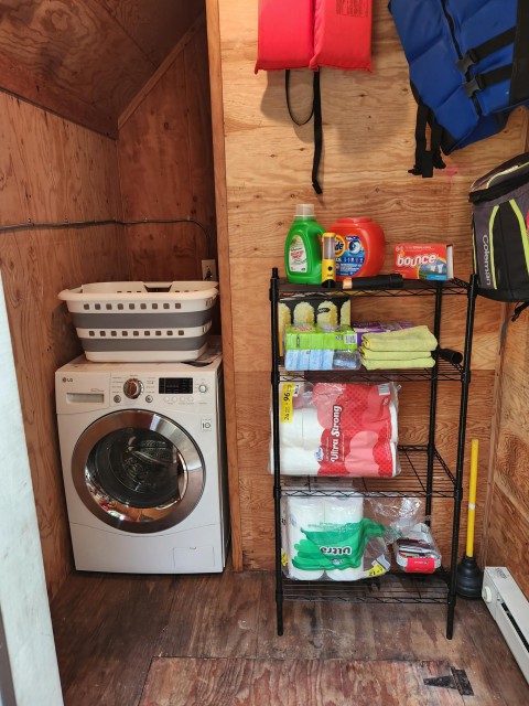 Laundry room, wash/dry combo unit, paper supplies/soap