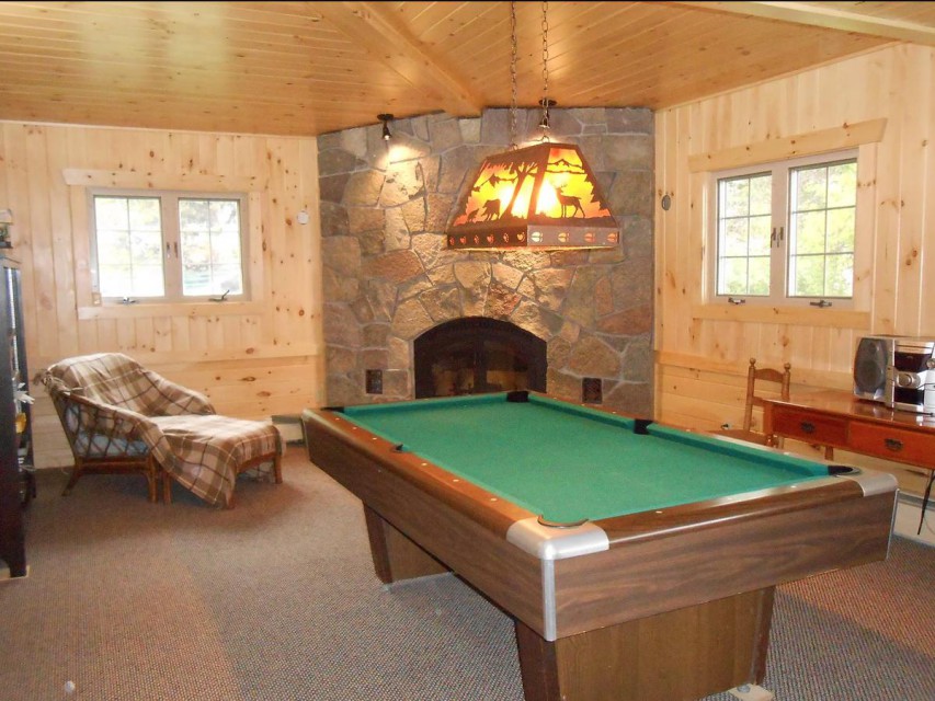 Lodge living room, wood burning fireplace, pool table