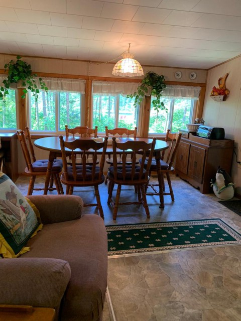 The dining room overlooks the pond.