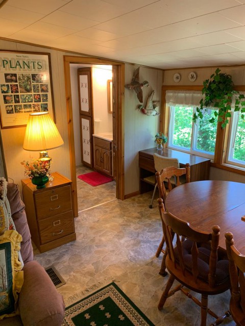 A small desk overlooks the pond off the dining room.