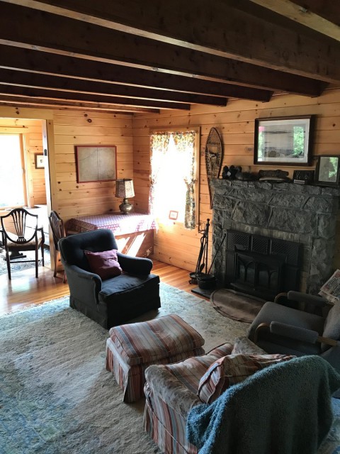 Living room with wood burning fireplace