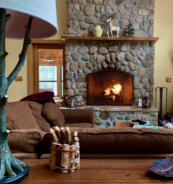 family room with stone fireplace  